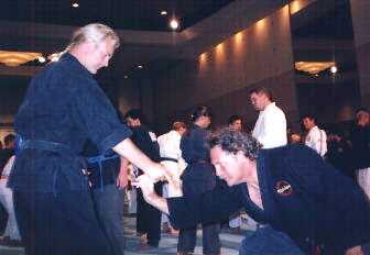 Hans Ingebretsen and Dale Kahoun practice a finger lock